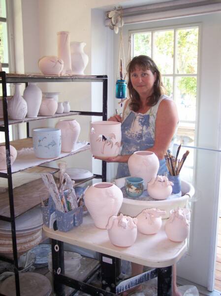 Alicia Lowe, Co-owner of River Safaris and Gulf Charters, is a local artist who crafts nature-based items for sale in Old Homosassa.
