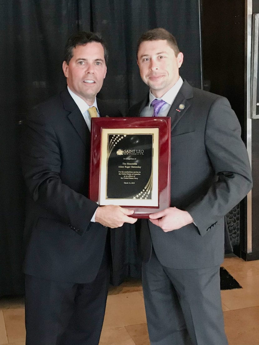 State Rep. Adam Hattersley accepts an award of recognition from Saint Leo University President Jeffrey Senese.