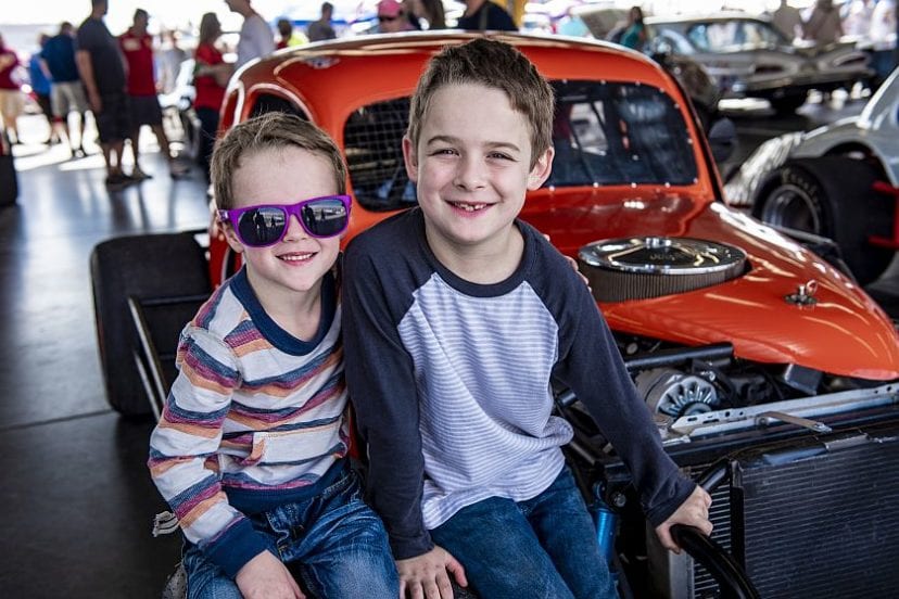 Kids in front of cars at Daytona Turkey Run